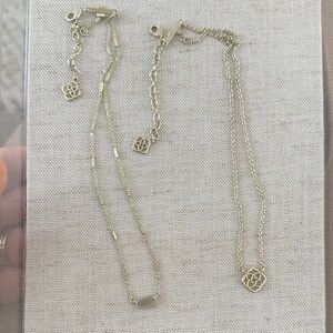 X2 Kendra Scott gold logo necklaces